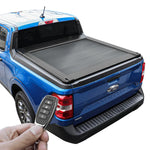 Blue Ford Maverick truck with a tonneau cover and a hand holding a key fob.