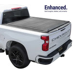 White Chevrolet Silverado truck with a tonneau cover on a white background
