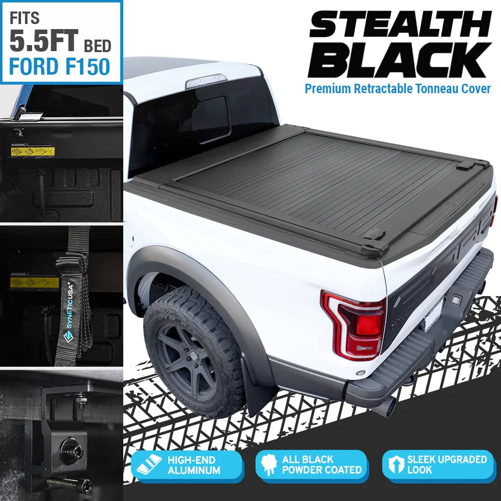 stealth black premium edition retractable tonneau cover installed on white F-150 Raptor