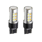 Two LED light bulbs with a white and amber color, designed for use in vehicle lighting, with a plug and socket connection type.