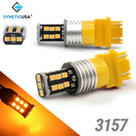 Two yellow LED bulbs with 'SYNETICUSA' branding on a white background.