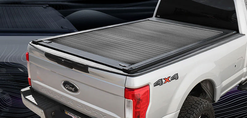 White Ford f-250 8ft bed truck with a syneticusa tonneau cover on a dark background