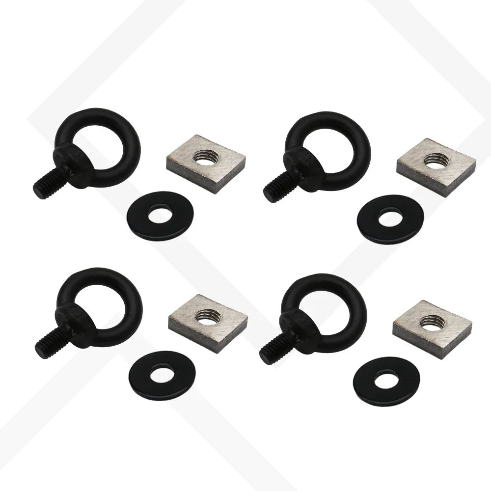 Set of black eye bolts and washers on a white background