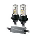 A pair of Syneticusa LED Type2 switchback bulbs with a non-polarity design, featuring white and amber colors, with a built-in controller box.