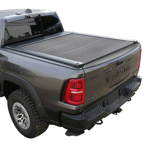 SYNETICUSA retractable tonneau cover installed on a gray Ram 1500 truck with a 5.7ft bed, providing a secure and flexible seal.