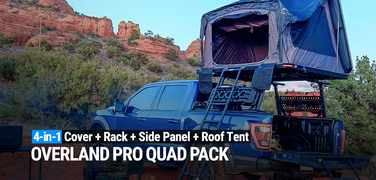 Blue truck with Overland Pro Quad Pack setup in a desert landscape