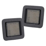 Two square license plate light with metallic grating inside on a white background