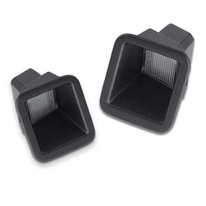 Two black license plate lights on a white background