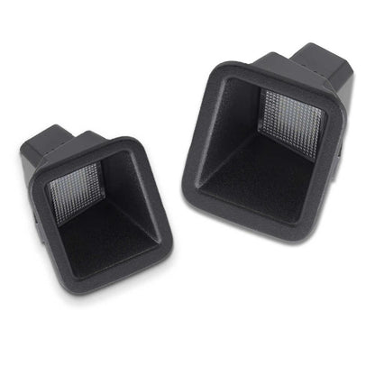 Two black license plate lights on a white background