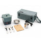 A camping cooking set arranged on a white background, including a gray insulated container, a matching carrying bag, stainless steel pots and utensils, a wooden cutting board, and a power cord.