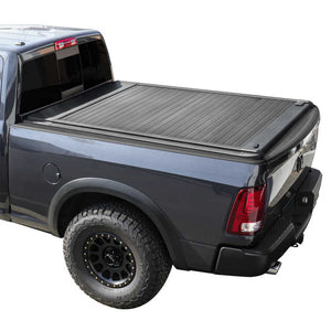 enhanced MB retractable bed cover on a metallic blue RAM 2500 truck with a white background