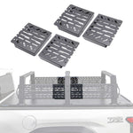 Four extension panels shown above a faded in-use view of the same rack mounted on a truck bed. The product appears to be a set of truck bed rack grates or cargo rack components.