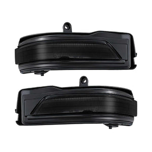 Two black car side mirror blinkers on a white background