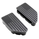 A pair of black rubber vehicle step plates featuring an American flag design, with a raised star field in the upper left and diagonal stripes, shown on a plain white background.