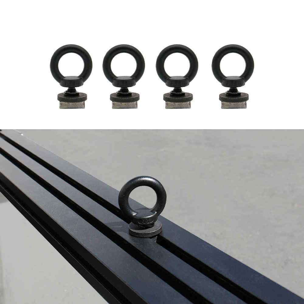 Set of four black eye bolts on a white background with an additional eye bolt on a metal surface.