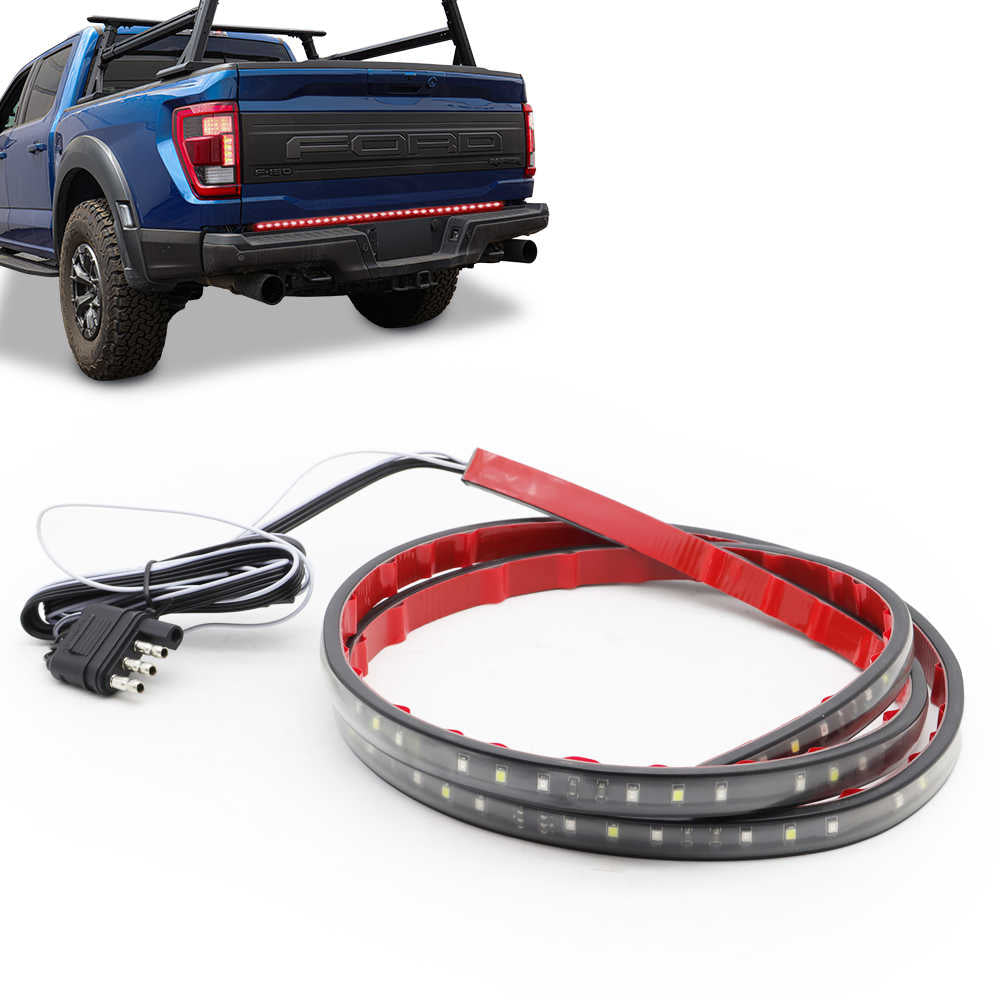 LED strip light with power cord in front of a blue pickup truck on a white background