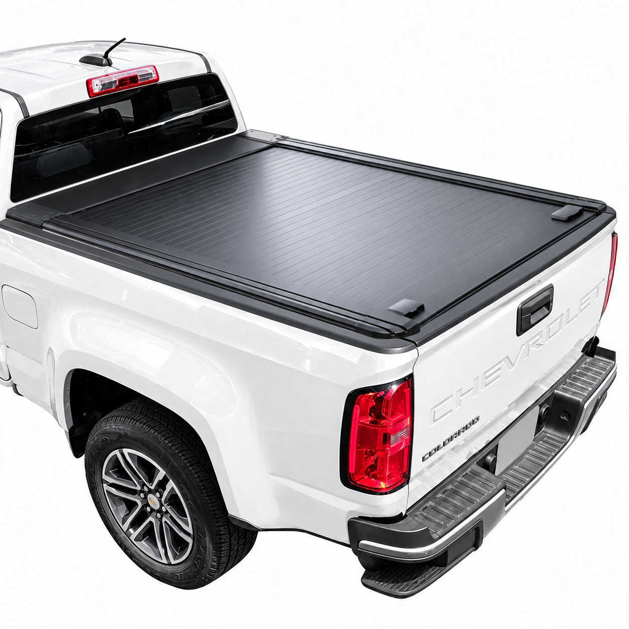 A black retractable truck bed cover installed on the bed of a white Chevrolet pickup truck, shown from a rear three-quarter angle against a plain white background.