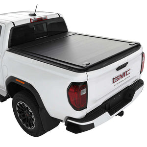 White GMC Canyon truck with a black enhanced mb tonneau cover on a white background