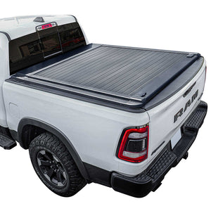 White Ram truck with a black enhanced MB tonneau cover on a white background