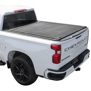 White Chevrolet Silverado truck with a syneticusa tonneau cover on a white background