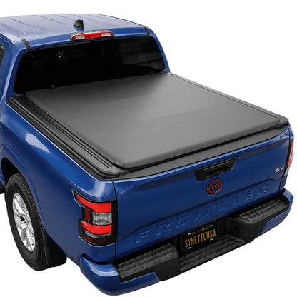 A soft roll up tonneau cover installed over the bed of a blue Frontier truck, shown from a rear three-quarter angle on a white background.