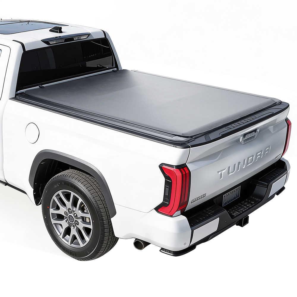 White Toyota Tundra standard bed truck with a soft roll up tonneau cover on a white background