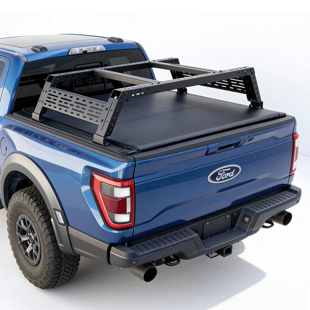 Blue Ford truck with a roof rack on a white background