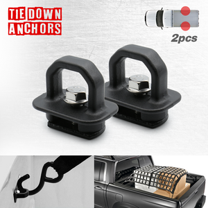 Two black universal truck cargo tie down anchor hooks mounted on a white background, with a depiction of how they can be used on a truck bed to secure cargo.