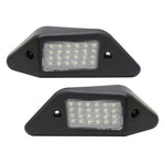 Two black LED license plate lights on a white background