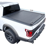 Retractable tonneau cover made of aluminum installed on the bed of a white f150 truck.
