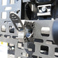 Close-up of a metal bracket with screws and a textured surface