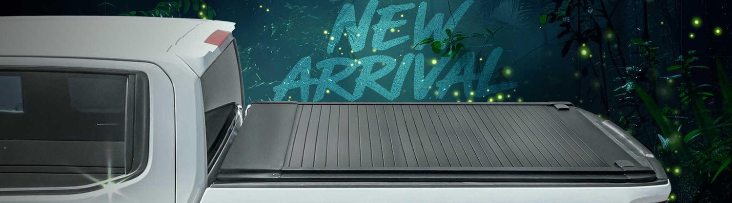 Truck bed with a 'New Arrival' sign on a dark background