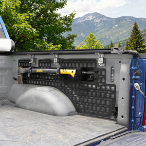 Truck bed with storage system and tool mounted, mountainous landscape in the background