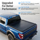 A blue pickup truck with a black tonneau cover installed in the bed, shown on a light gray studio background with marketing text and bullet points about double T-Slot rails, light bar readiness, and improved installation.