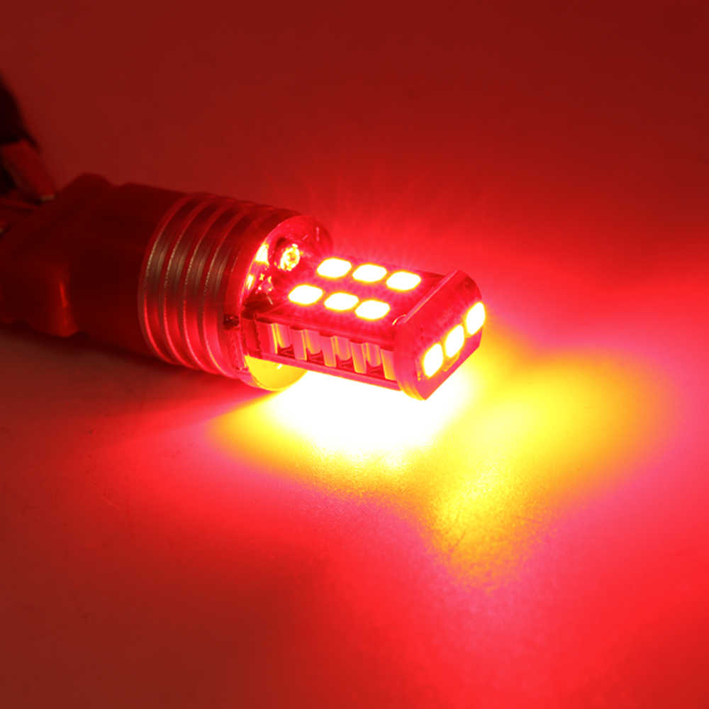Red LED light bulb on a red background
