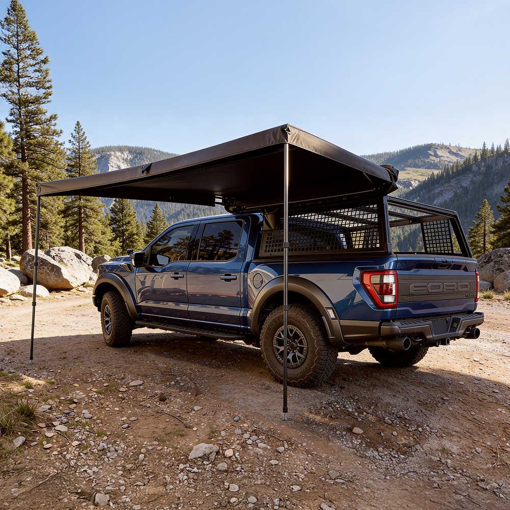 Ford truck with an extended side awning in a mountainous area
