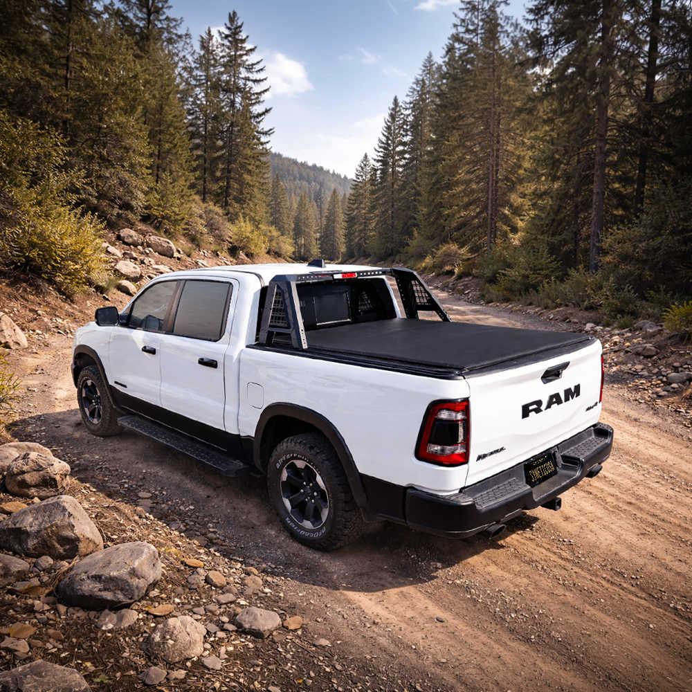 White Ram truck on a dirt road surrounded by trees