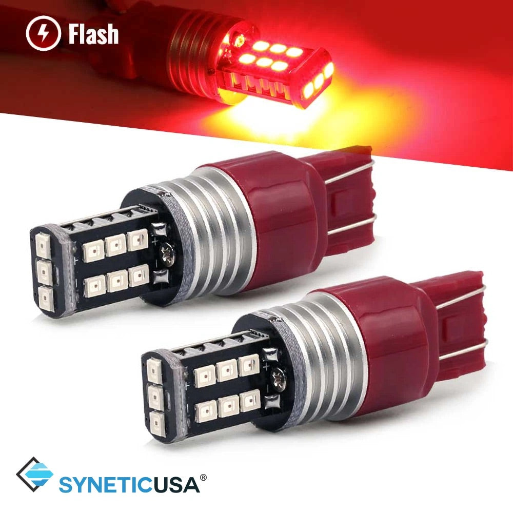 Two 7443 red LED bulbs with a flash effect and SYNETICUSA branding.