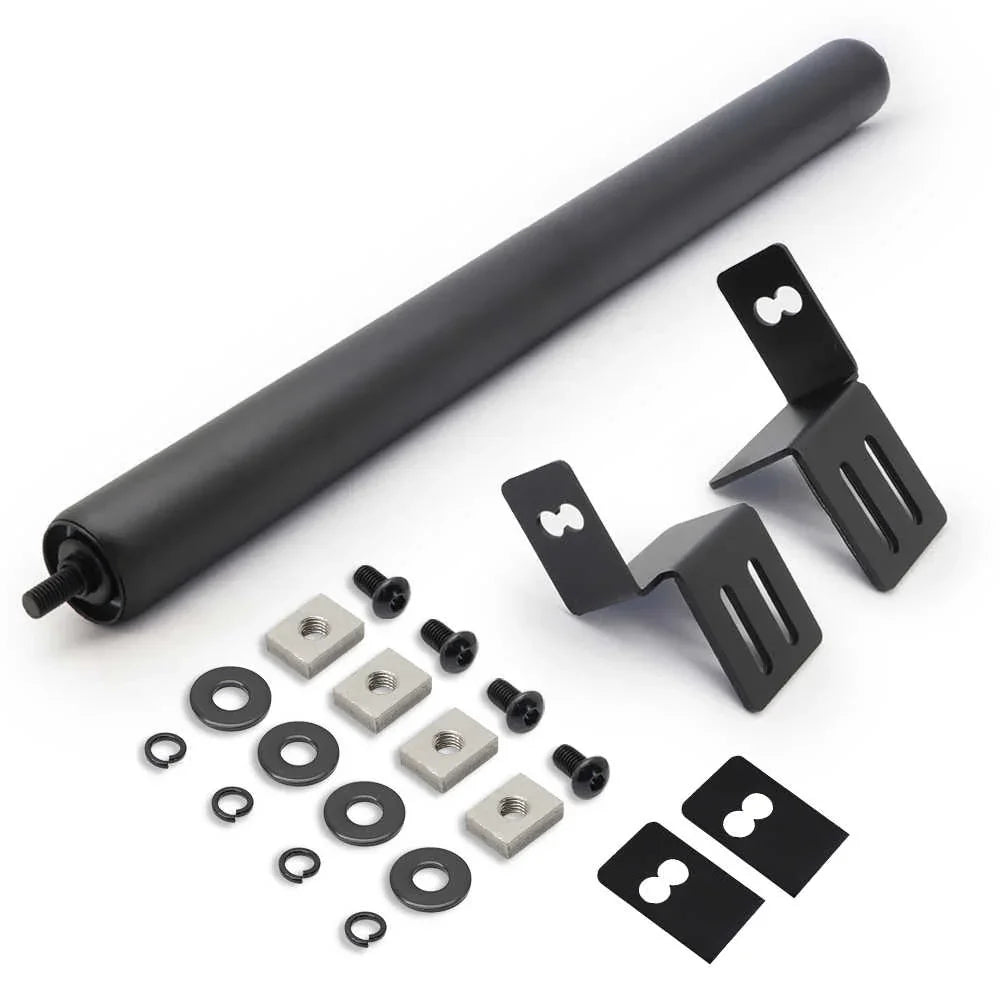 Set of components including a large black roller and various smaller parts on a white background