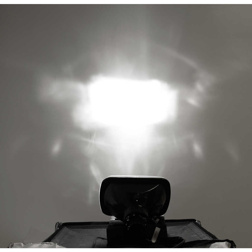 led projector reflecting a bright light on a gray background