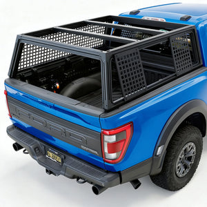 Black metal mesh tailgate cargo carrier rack installed on the bed of an orange Ford pickup truck, shown from a rear three-quarter angle.