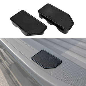 Two black textured plastic truck bed liner guards shown on a white background, with one also pictured installed on the side of a gray pickup truck bed.