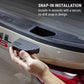 A hand holding a black snap-in step pad next to a beige truck bed, with text reading 'SNAP-IN INSTALLATION' and 'Installs in seconds with a secure, no-drill snap-in design.'.