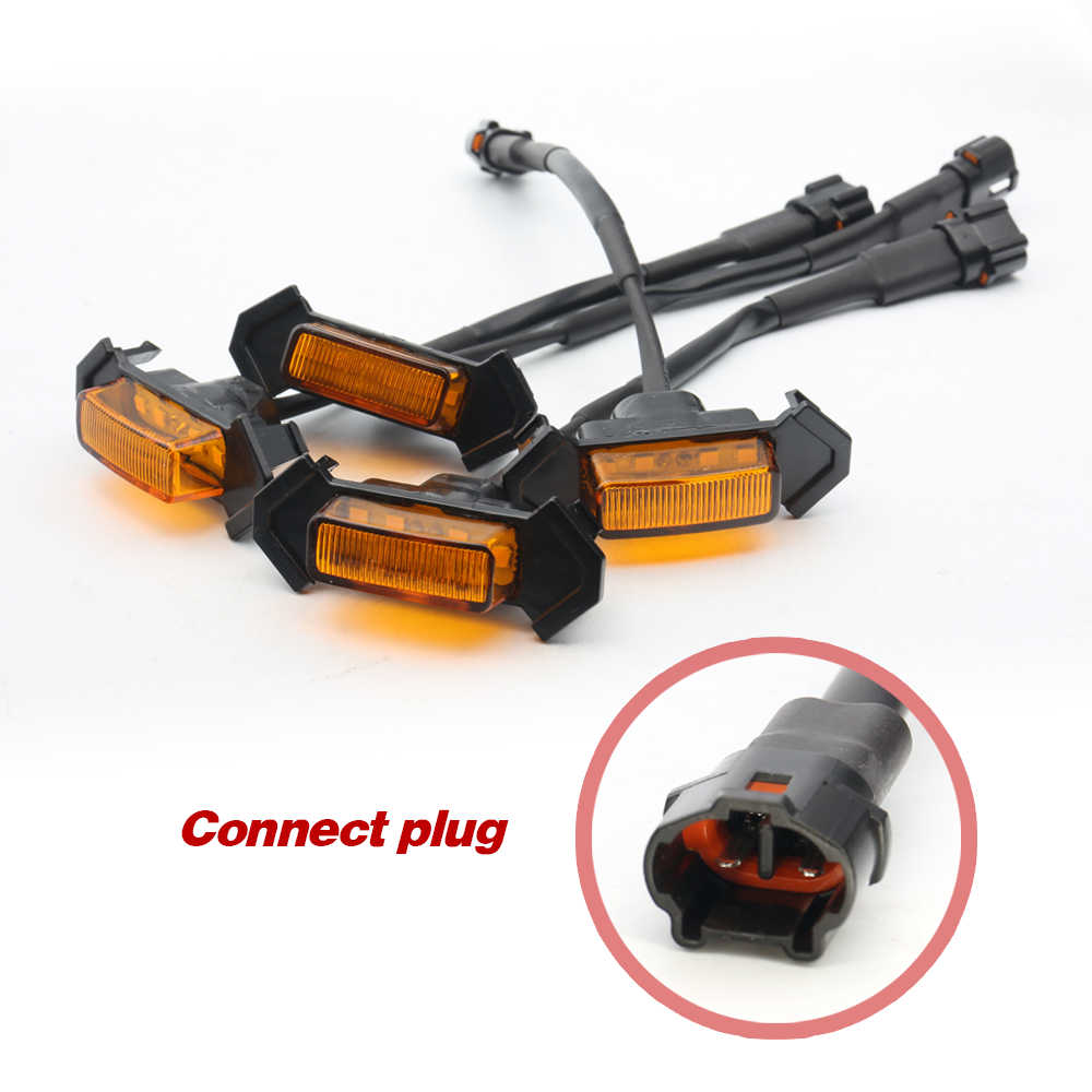 Set of automotive indicator lights with a close-up of a connect plug on a white background.