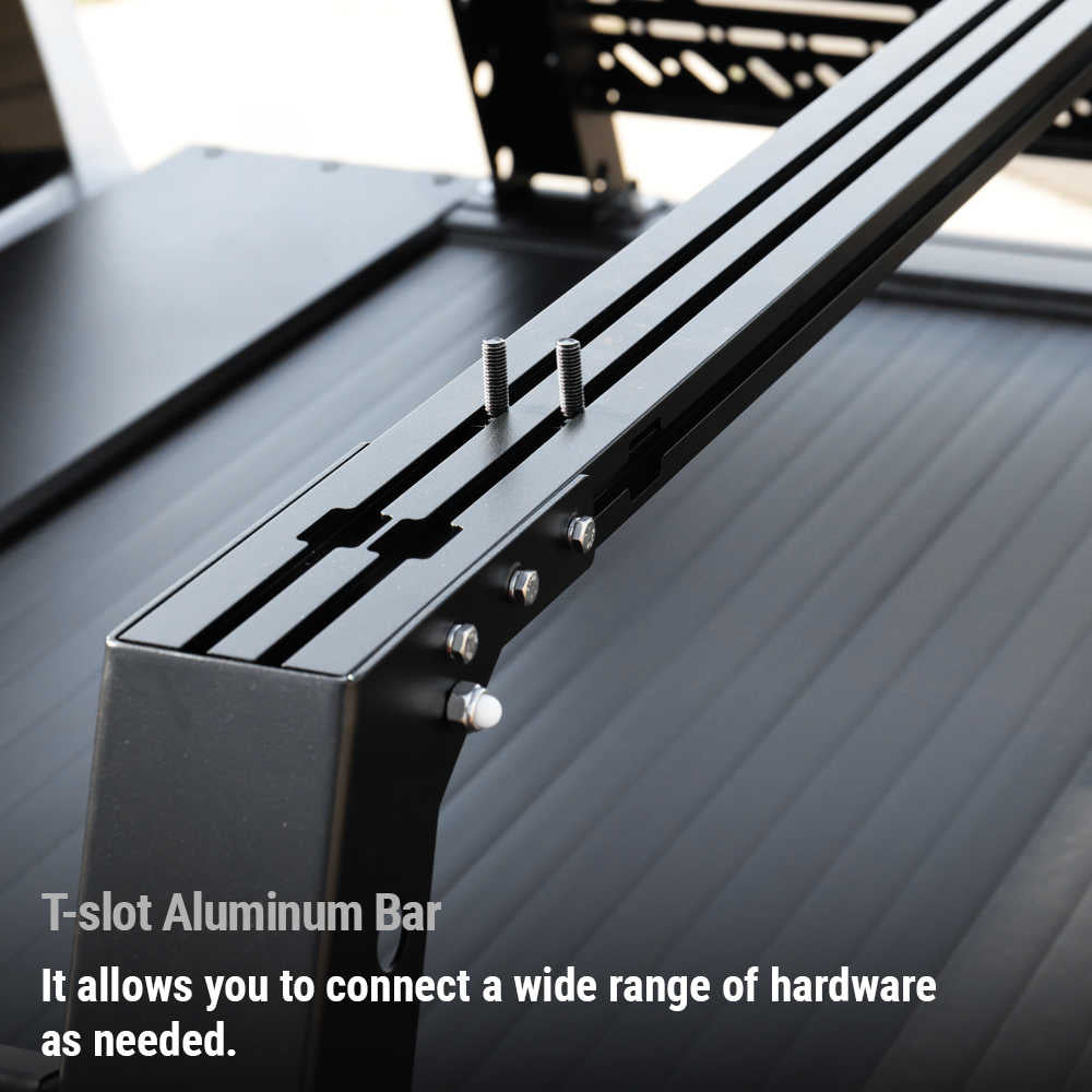 Close-up of a black T-slot aluminum mounting bar with screws and hardware, shown attached to a dark metal frame. White text at the bottom reads: 'T-slot Aluminum Bar It allows you to connect a wide range of hardware as needed.