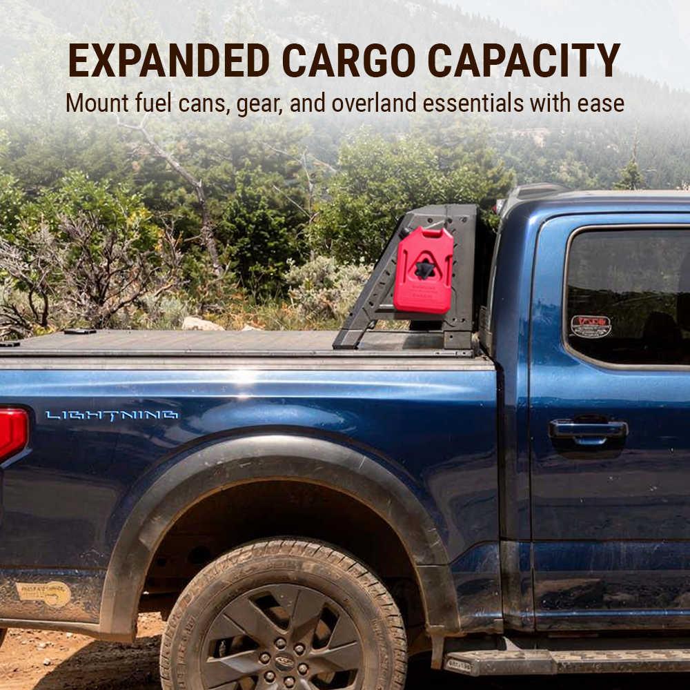 Blue truck with a red fuel can mounted on a holder, set against a natural landscape.