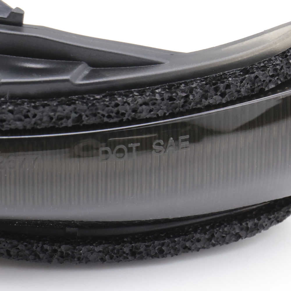Close-up of a black shoe sole with textured surface and 'DOT SAE' text on a white background