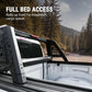 Truck bed with roll bar extension in a forest setting, highlighting 'Full Bed Access' feature.
