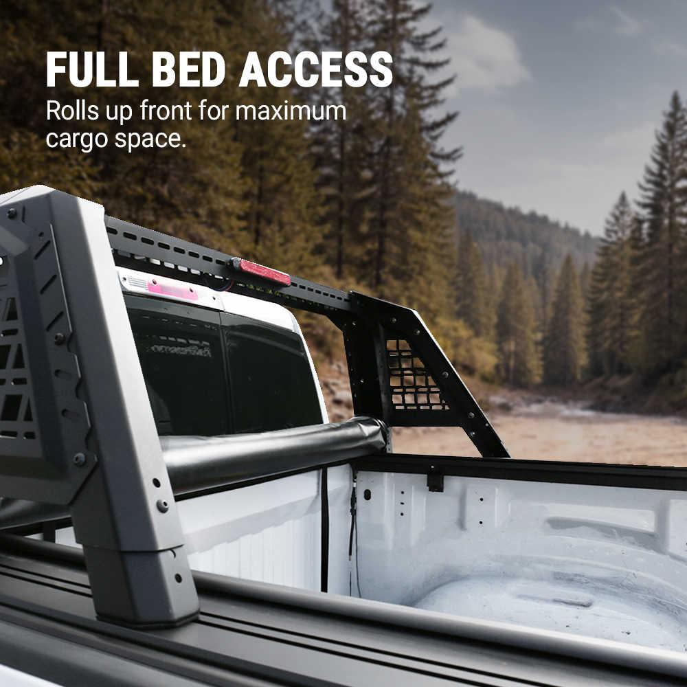 Truck bed with roll bar extension in a forest setting, highlighting 'Full Bed Access' feature.