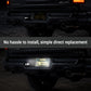 A rear view of a black truck showing a small rectangular light mounted near the license plate area. The top and bottom panels show the light in different positions, with a central text banner reading 'No hassle to install, simple direct replacement.